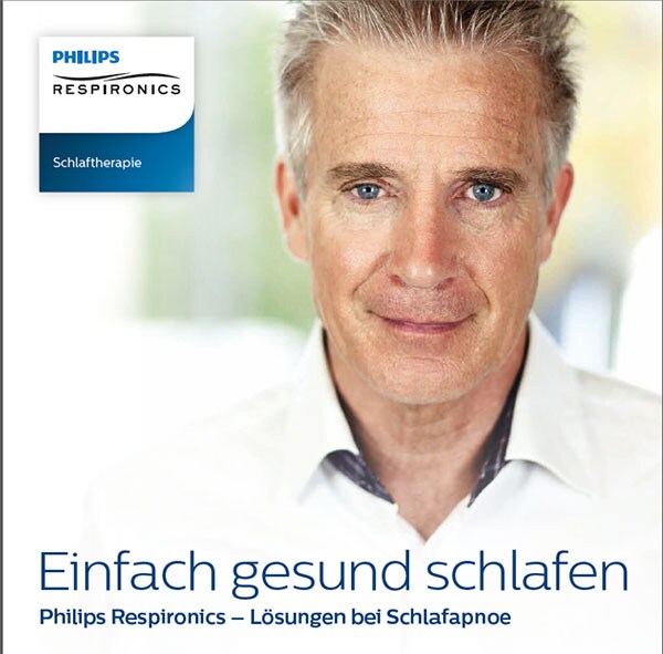 ein Mann mit grauen Haaren und einem weißen Hemd